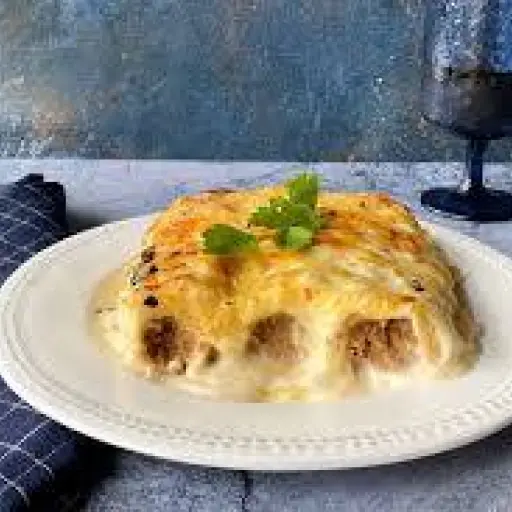 Receta tradicional de canelones de pollo con salsa bechamel