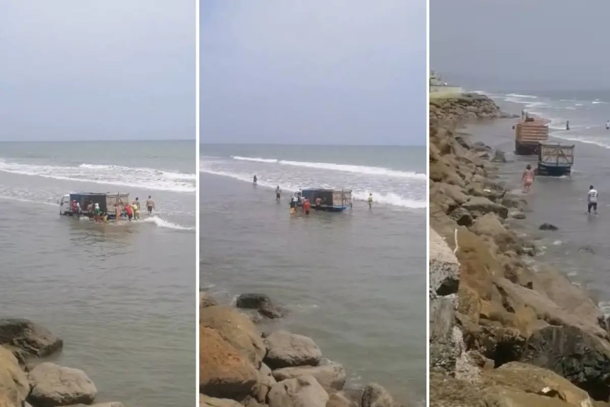 Momentos en que el camión es arrastrado por el mar y luego remolcado.